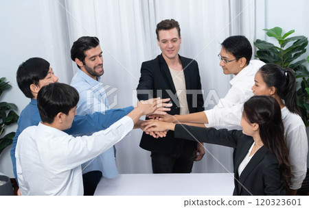 Group of diverse office worker join hand together in office. Prudent Group of diverse office worker join hand together in office. Prudent 120323601