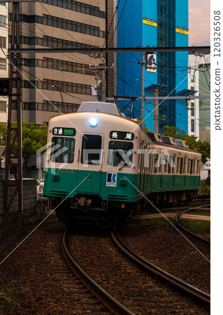 An early morning Kotoden train leaving Takamatsu Chikko Station 120326508