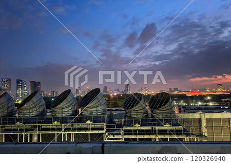 Industrial large water air cooling tower Chiller chimney at dusk Industrial large water air cooling tower Chiller chimney at dusk 120326940