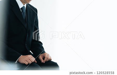 Middle-aged businessman having an interview Middle-aged businessman having an interview 120328558