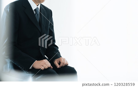 Middle-aged businessman having an interview Middle-aged businessman having an interview 120328559