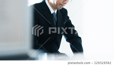 Middle-aged businessman having an interview Middle-aged businessman having an interview 120328562