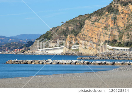 Breakwater on Mediterranean beach. Nature of sea and mountains. Setri Levante, Liguria.  120328824