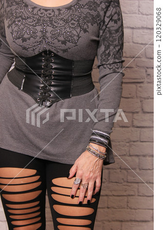 Woman Wearing Vintage Gothic Style Thrift Store Clothing Woman Wearing Vintage Gothic Style Thrift Store Clothing 120329068