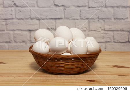 Basket of Farm Fresh Chicken Eggs on kitchen Table 120329306