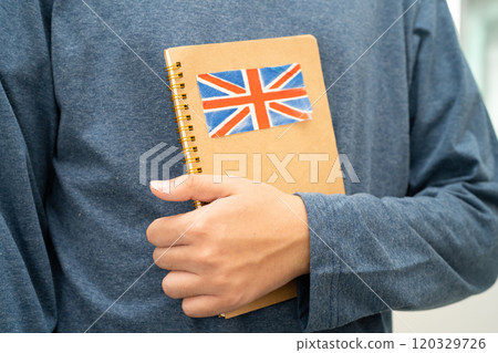Learn English language, Asian teenage student hold book with flag in course at school. 120329726