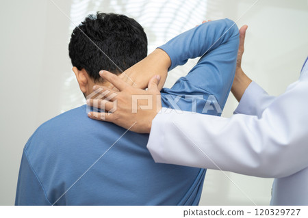 Physical therapy, Asian therapist doctor treat perform pain young man in hospital. 120329727