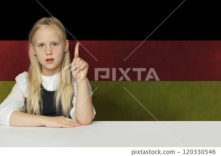 Blonde young child girl on German flag background. Education and study language in Germany concept Blonde young child girl on German flag background. Education and study language in Germany concept 120330546