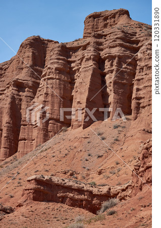 Rocky columns of red sandstone in Konorchek canyon, aeolian deposits Rocky columns of red sandstone in Konorchek canyon, aeolian deposits 120331890