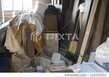 Garbage house. A pile of garbage illegally dumped in an abandoned house 120333057