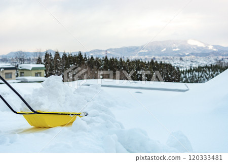 Dumping snow into a snowy mountain with a snow dump 120333481