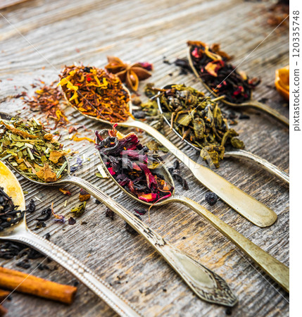dry teas on wooden background dry teas on wooden background 120335748