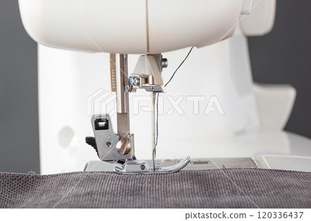 Sewing machine, stitching fabrics, needle in a round plan 120336437
