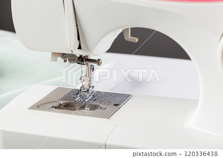 Sewing machine, stitching fabrics, needle in a round plan 120336438