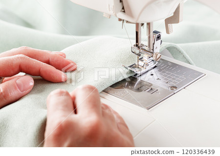 Sewing machine, stitching fabrics, needle in a round plan 120336439