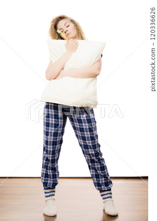 Sleepy woman wearing pajamas Sleepy woman wearing pajamas 120336626