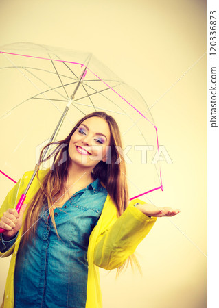 Woman in rainproof coat with umbrella. Forecasting Woman in rainproof coat with umbrella. Forecasting 120336873