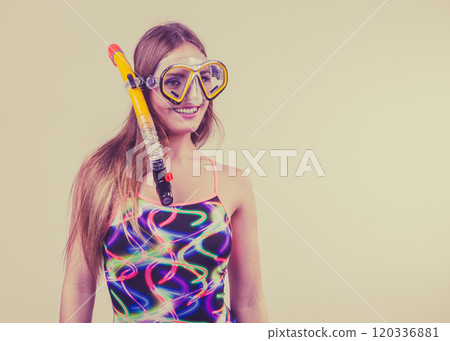 Woman with snorkeling mask having fun Woman with snorkeling mask having fun 120336881