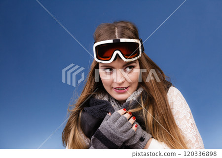 skier girl wearing warm clothes ski googles portrait. 120336898