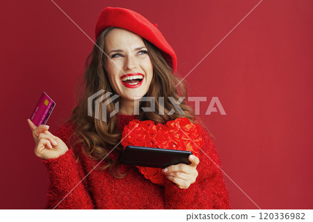 happy stylish woman in red sweater and beret shop online 120336982