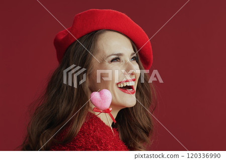 happy elegant 40 years old woman in red sweater and beret happy elegant 40 years old woman in red sweater and beret 120336990