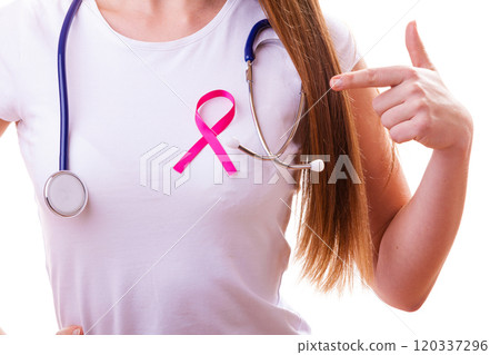 Pink ribbon and stethoscope on female chest 120337296