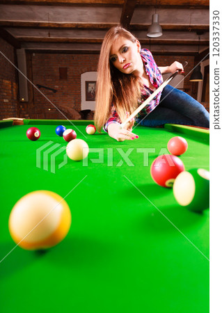 Young fashionable girl playing billiard. Young fashionable girl playing billiard. 120337330