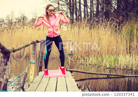 Young sports woman taking break after a run. Young sports woman taking break after a run. 120337341