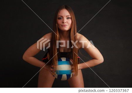 Young woman wear sportswear and hold ball. 120337367