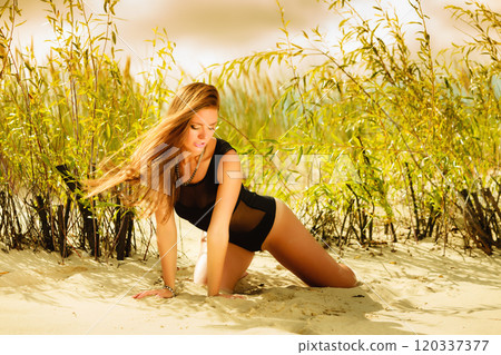 Beautiful sexy girl in swimwear on beach. 120337377