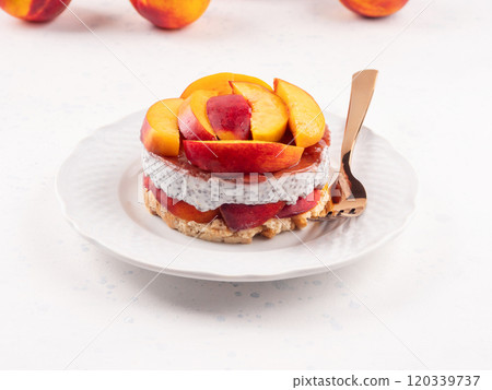 Overnight chia pudding dessert with greek yogurt, peaches and jam 120339737