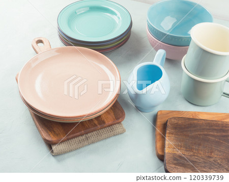 Set of pastel pink, blue color tableware on turquoise background 120339739