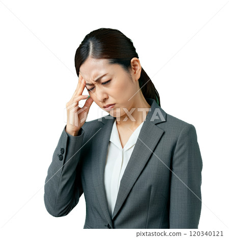 A woman suffering from a headache 120340121