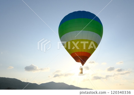 A balloon floating on the morning sun 120340336