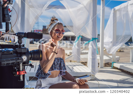 Female blogger is going to record video 120340402