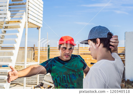 camera operator and director discuss the process of a commercial video shoot 120340518