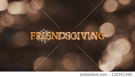 Image of friendsgiving text and flickering spot lights on brown background 120341300