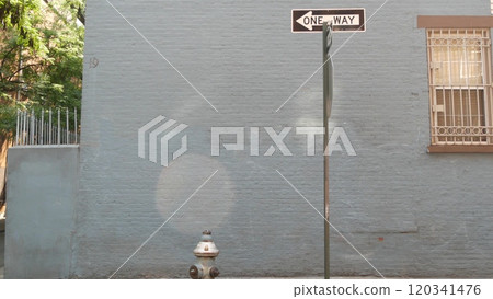 New York City oneway crossroad, Minetta street intersection, one way road sign. Manhattan, Greenwich 120341476