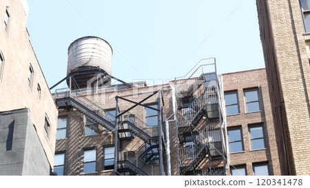 New York City building architecture. Residential house exterior. USA real estate. Rooftop water tower 120341478