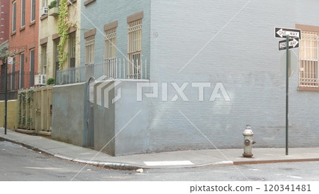 New York City oneway crossroad, Minetta street intersection, one way road sign. Manhattan, Greenwich 120341481