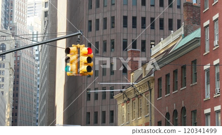 New York City street crossroad, yellow traffic light, transport road intersection, United States. 120341499