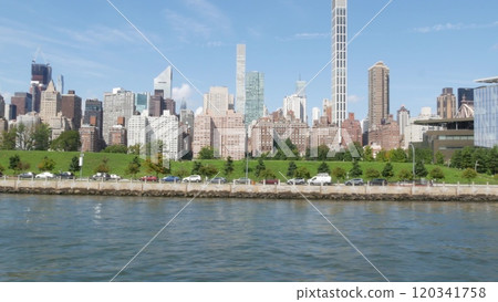 New York City skyline from ferry boat. Manhattan midtown, East river, Queensboro bridge, USA. New York City skyline from ferry boat. Manhattan midtown, East river, Queensboro bridge, USA. 120341758