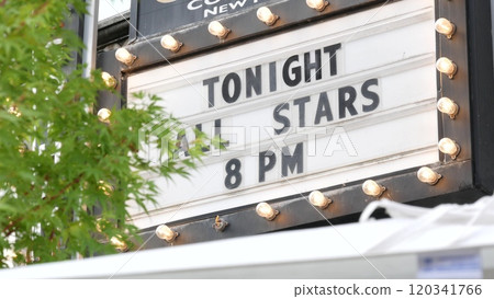 Retro marquee sign, light bulbs. Movie theater or cinema theatre vintage facade signage. Old letters Retro marquee sign, light bulbs. Movie theater or cinema theatre vintage facade signage. Old letters 120341766