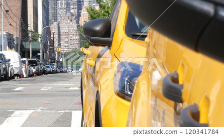 New York City. Row of yellow Taxi cars on street, Queens. Taxi cabs, Long Island. Medallion taxicab. New York City. Row of yellow Taxi cars on street, Queens. Taxi cabs, Long Island. Medallion taxicab. 120341784