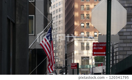 New York City Manhattan Downtown Financial District street architecture, FiDi buildings, USA flag. 120341795