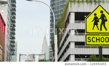 School zone yellow road sign, pedestrian crossing. Children safety on street, Queens, New York City. 120341855
