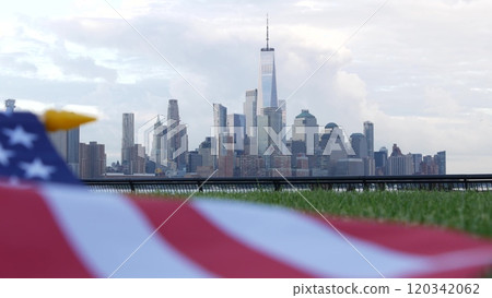 New York City waterfront skyline, Manhattan Downtown World Trade Center cityscape. American USA flag New York City waterfront skyline, Manhattan Downtown World Trade Center cityscape. American USA flag 120342062