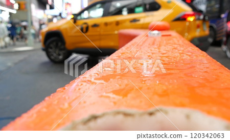 New York City Times Square, Manhattan Midtown Broadway street, USA. Wet road on rainy day, traffic. New York City Times Square, Manhattan Midtown Broadway street, USA. Wet road on rainy day, traffic. 120342063