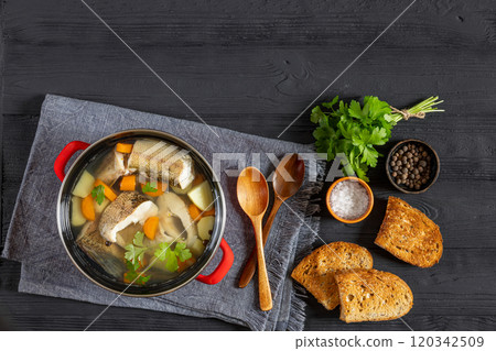 Clear Pike soup with veggies and spices, top view Clear Pike soup with veggies and spices, top view 120342509