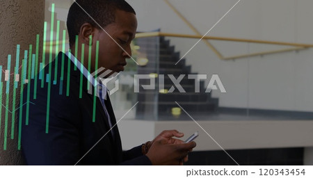Image of diagrams over biracial businessman using smartphone 120343454